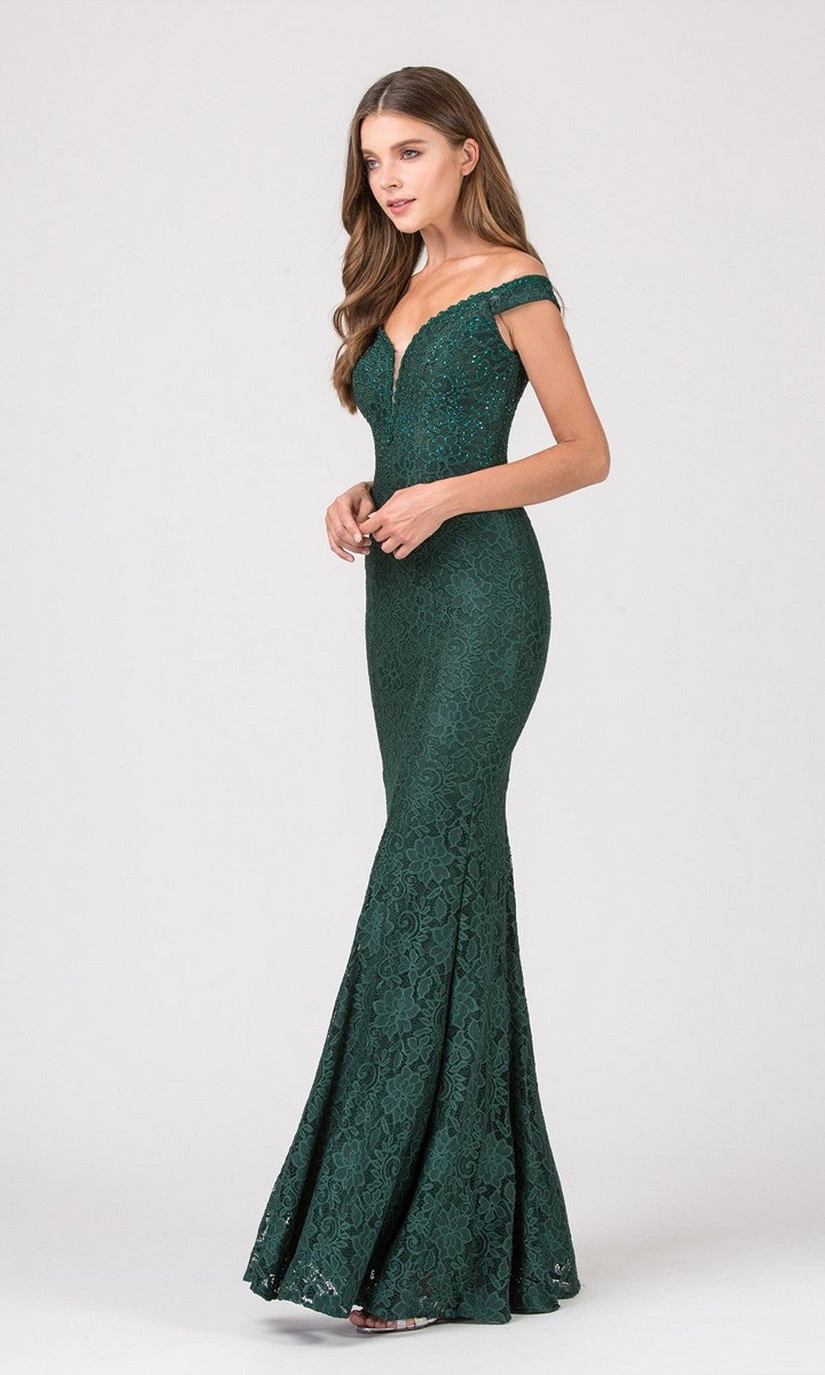 A woman wearing the Eureka 8050 Long Prom Dress in hunter green stands elegantly against a plain light background.